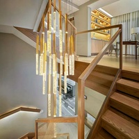 Lustre moderne contemporain en cristal doré en spirale suspendu à LED pour long escalier de villa