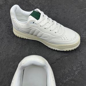 Chaussures de sport pour hommes de marque haut de gamme - cuir véritable luxueux - adaptées aux hommes et aux femmes - vêtements décontractés luxueux - Product Image 1