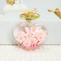Porte-clés créatif et tendance en acrylique multi-formes avec paillettes liquides, breloque Sakura à pétales de fleurs roses flottants, style dessin animé mignon