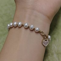 Bracelet en perles de riz d'eau douce avec fermoir Ruyi - Bijou porte-bonheur avec breloques CZ et coquillages pour femme