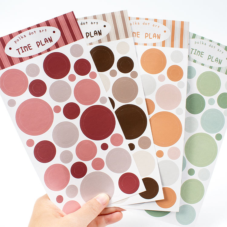 Autocollant en papier couché + exemple en couleur