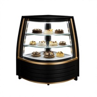 Vitrine de boulangerie d'angle réfrigérée sur mesure, noir mat et or, avec verre incurvé, éclairage LED et 3 étagères