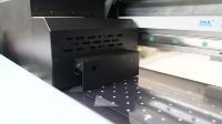 Nouvelle solution 2025 Imprimante UV9060 pour l'impression de badges en TPU pour les maillots et les uniformes scolaires Impression de logo 3D Imprimante UV à plat
