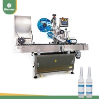 Applicateur d'étiquettes horizontales de précision pour tubes de petit diamètre et contenants cylindriques dans l'industrie alimentaire