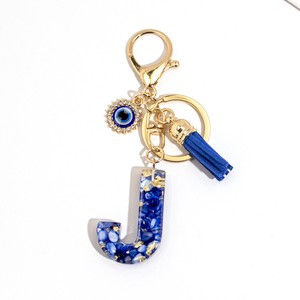 Superventas transfronterizo: Llavero de <span class=keywords><strong>moda</strong></span> azul zafiro con letra inglesa, colgante de borla Ojo del Diablo para decoración de bolso, regalo de joyería - Product Image 6