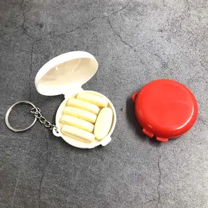 1 boîte à pilules en plastique, boîte à pilules de forme ronde avec porte-clés soins médicaux