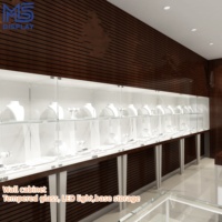 Vitrine de présentation de bijoux LED sur mesure au design créatif pour magasin de bijoux en centre commercial