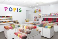 Présentoir design moderne personnalisé pour magasin de sucettes et de bonbons Éclairage LED populaire Décoration d'aliments sucrés Vitrine à vendre