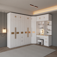 Meubles de chambre à coucher modernes et luxueux, armoire d'angle en panneaux de particules MDF personnalisés avec table de toilette intégrée