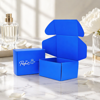 Caja de Envío Azul Personalizada con Logotipo Estampado en Plata para Perfumes, Fabricada con Cartón Corrugado Tipo E, Ideal para Suscripciones de Fragancias