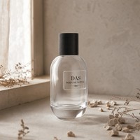 Flacon de parfum en verre de luxe 100 ml avec pompe pulvérisatrice, cadre noir, épaule incurvée, FEA 15, OEM ODM, vente en gros, gaufré