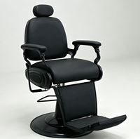 Fauteuil de barbier moderne tout noir, hydraulique, inclinable, pivotant, avec appui-tête et repose-pieds réglables pour salon de coiffure
