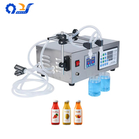 Machine de remplissage de liquides semi-automatique GFK-280-2 avec construction en acier inoxydable pour l'embouteillage de boissons et de jus à petite échelle