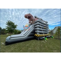 Structure gonflable dinosaure à succès avec toboggan aquatique, en PVC durable, idéale pour événements extérieurs et parcs d'attractions