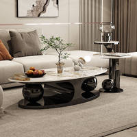 Italienischer Couchtisch aus hellem Stein mit ovaler Platte, luxuriöser, schlichter Beistelltisch mit Doppelkugel-Design für den Haushalt, Internet-Kombination