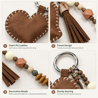 Mini breloque cœur mignonne en similicuir PU, avec pompon perlé et cordon tressé, utilisable comme porte-clés, sangle pour étui de téléphone ou pendentif créatif pour sac à dos