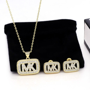 Nouvel ensemble de bijoux de créateur en acier inoxydable plaqué or 18 carats pour femmes, avec collier et boucles d'oreilles ornés de zirconiums cubiques luxueux et de la lettre <span class=keywords><strong>MK</strong></span> - Product Image 1