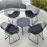 Ensemble table et chaises de salle à manger de forme géométrique moderne, cadre en fer forgé, pieds en alliage d'aluminium, tissu imperméable, finition résistante aux rayures