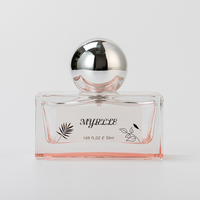 Flacon de parfum rectangulaire de luxe en verre rose transparent, longue durée, avec bouchon en forme de boule
