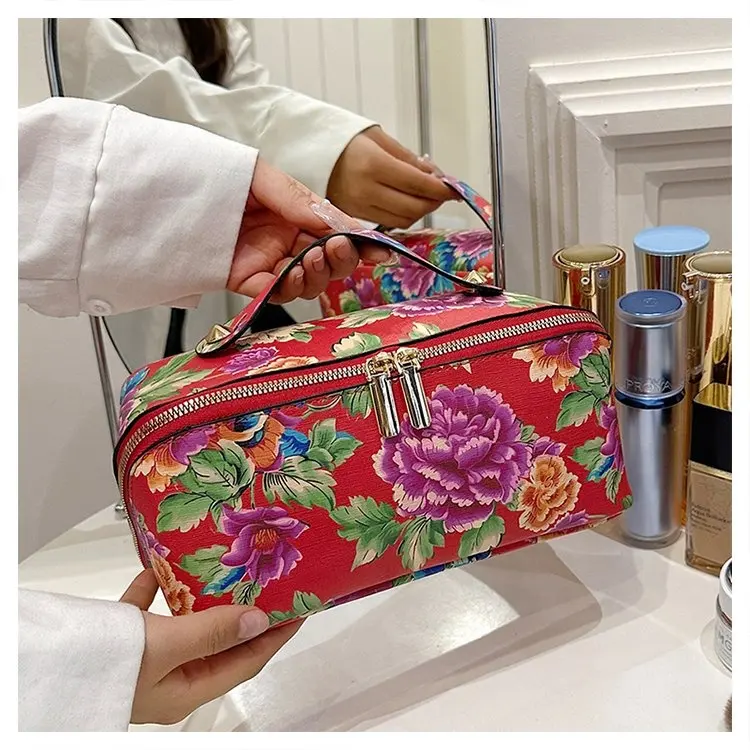 Elegante borsa per il trucco a fiori di lusso Custom custodia cosmetica in pelle sintetica per viaggi all'aperto da donna con manico floreale per Make Up