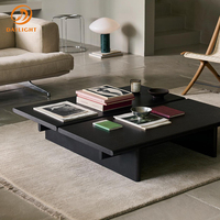 Table basse en bois massif de frêne noir carbonisé de style moderne et créatif avec piètement métallique élégant et silencieux pour salon d'appartement