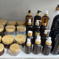 Pot et bouteille cosmétiques en plastique ambré en gros avec couvercle en bambou, conteneur d'emballage vide pour huile capillaire, shampoing, soins corporels