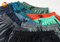 Shorts de basketball pour hommes style streetwear, élastiques, unis, taille mi-haute, respirants, séchage rapide, pantalons cargo athlétiques d'été – Vente en gros