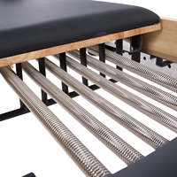 Combinaison trapèze réglable en chêne naturel robuste avec barre de pieds antidérapante pour studio de Pilates et bien-être