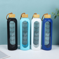 Botol Air Kaca Borosilikat Grosir 32oz dengan Tutup Bambu, Cangkir Kaca, dan Sarung Pelindung Silikon