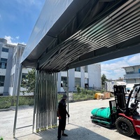 Tente rétractable motorisée résistante aux UV en PVC avec structure en acier galvanisé et roues pour atelier d'usine - Toutes saisons