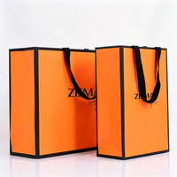 Sacs en papier orange de haute qualité pour vêtements, avec ruban gros-grain imprimé, logo personnalisé, taille et couleur sur mesure, grande capacité, emballage cadeau