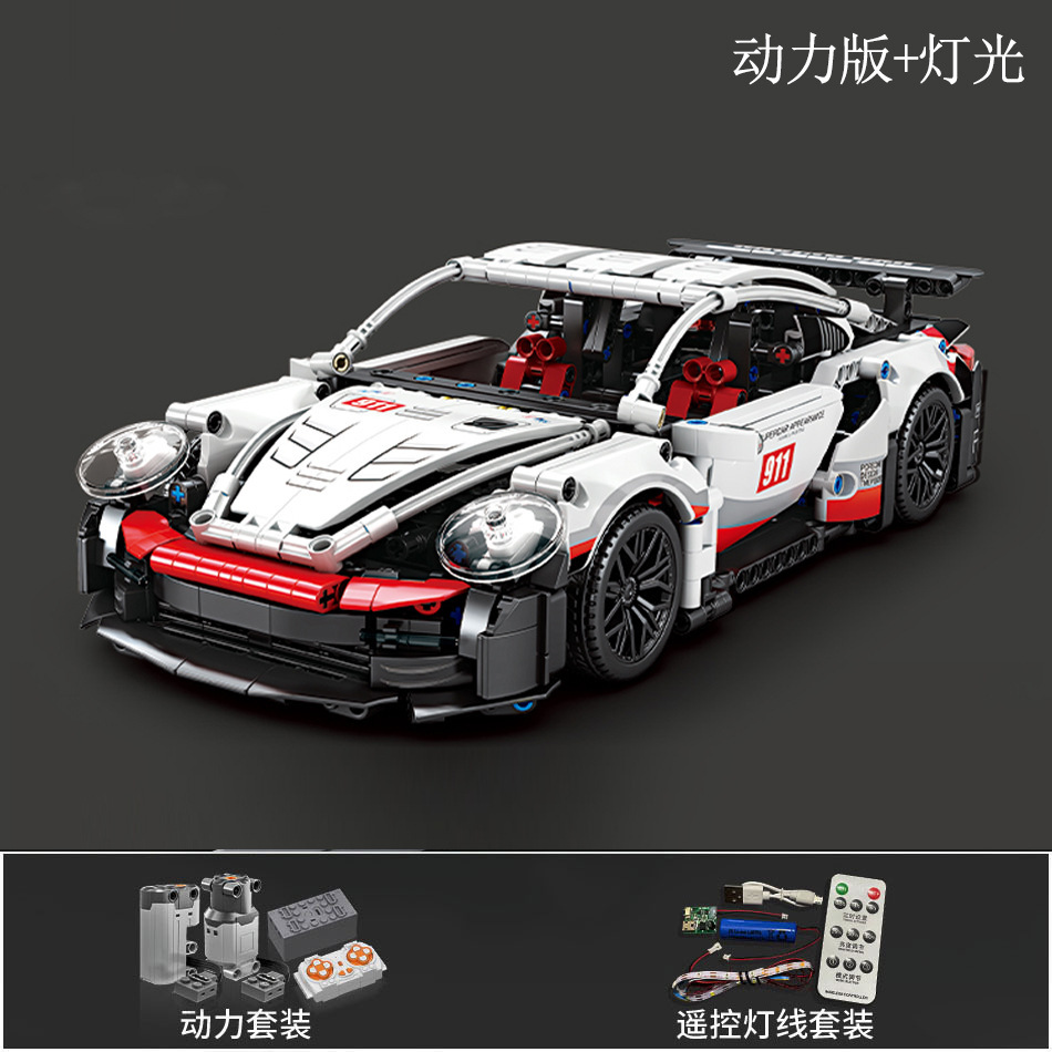 Caja de regalo con grupo de alimentación de iluminación 911, diseño en blanco y negro.