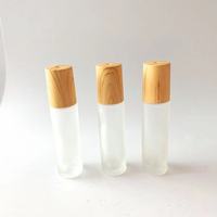 Boule de verre Bouteille en verre vide et ronde avec bouchon en bois Huile essentielle Huile de parfum Bouteille roulante en verre avec boule roulante