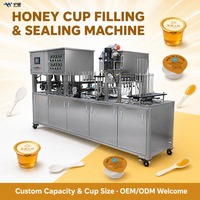 Machine de remplissage et de scellage entièrement automatique pour cuillères et gobelets, idéale pour la production de miel, sauces, confitures et boissons en gobelets en papier ou en plastique.
