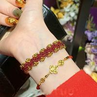 Bracelet en corde rouge porte-bonheur de qualité supérieure, tissé à la main, avec perles dorées, trèfle à quatre feuilles, réglable, cadeau pour femme