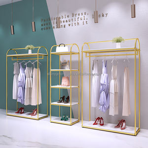 ที่กำหนดเองผู้หญิงขายปลีกเสื้อผ้ายืนแสดงสแตนเลสติดผนังชั้นวางเสื้อผ้าโลหะทองบูติกชั้นวาง<span class=keywords><strong>เสื้อผ้า</strong></span>สำหรับ<span class=keywords><strong>เสื้อผ้า</strong></span> - Product Image 3