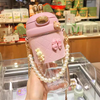 Bouteille d'eau pour enfants en gros 380ml 580ml mignon oreilles de lapin perles en métal chaîne sangle bouteille d'eau en plastique avec paille
