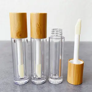 JIE MEI Stock respetuoso con el medio ambiente tapa de bambú 6ML cepillo grande brillo de labios varita tubo redondo vacío plástico labio aceite botella corrector contenedor