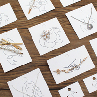 Cartes de présentation de bijoux en papier texturé avec logos personnalisés pour la vente en gros