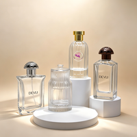 Flacon de parfum en verre transparent de luxe personnalisé avec boîte, 100 ml, vaporisateur à pompe, design plat, emballage avec marquage à chaud, MOQ 100 pièces