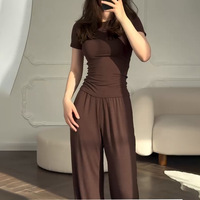Pantalon large décontracté extensible à col rond et manches 3/4, couleur unie, nouvelle mode, coupe ajustée, vente en gros d'usine pour femmes
