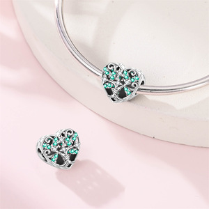 A green and white brass pendant featuring the classic four-leaf clover and heart motif, perfect for women - Product Image 5