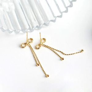 Xinfly Simple Fashion Bow Tassel Earrings 18K Gold Lace Plain AU750 Earrings for Women for Parties and Trendy Style - Product Image 4
