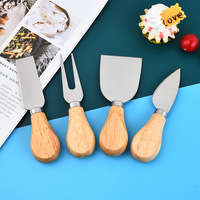 Coltelli da formaggio 4 pezzi con manico in legno, tra cui Mini forcella a forchetta, piano stretto e coltello da spalmare in metallo