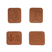Étiquettes de taille imprimées d'étiquettes de vêtements en cuir durables en relief OEM/ODM avec techniques brodées