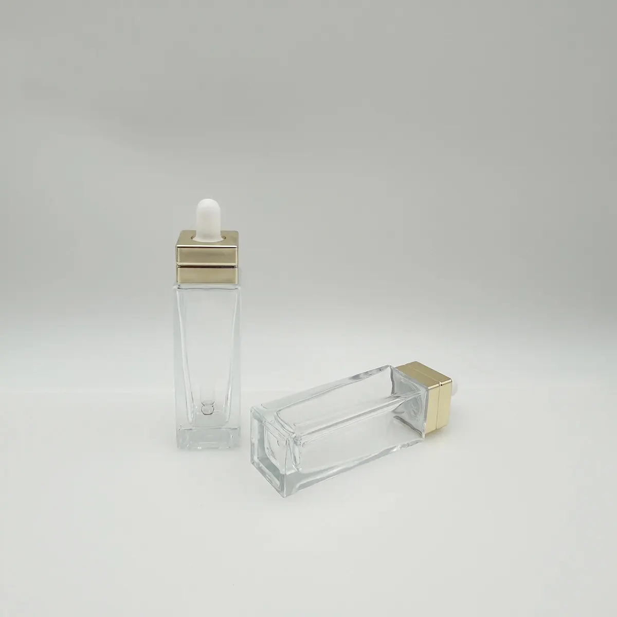 Customized Unique Essential Oil Dropper Bottle 20ml 40ml 50ml Glass Round Dropper Bottle Packaging With Plastic Dropper