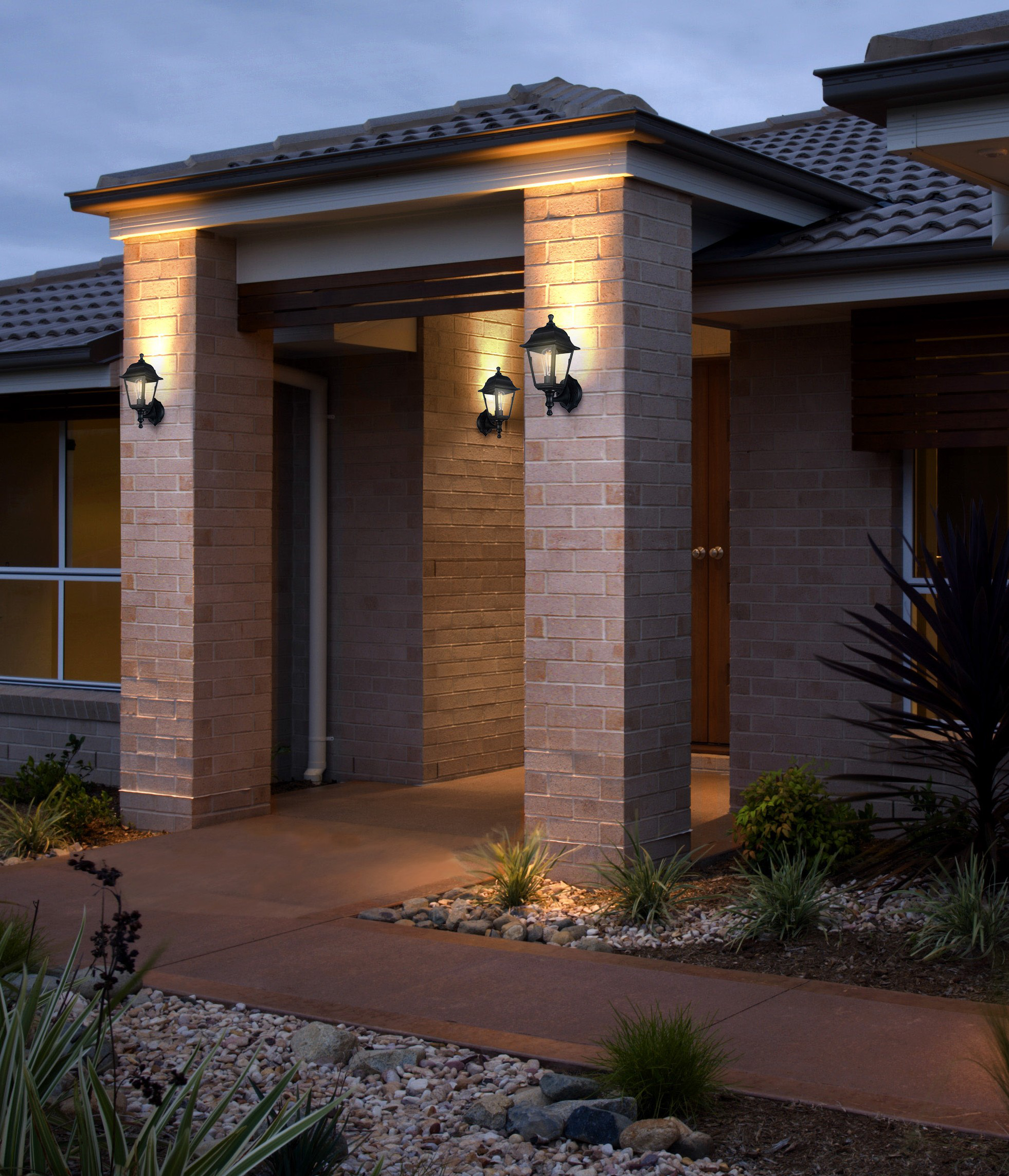 Security lantern on a patio wall at night