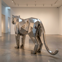 Grande sculpture géométrique en acier inoxydable poli, motif léopard, art urbain minimaliste pour extérieur, statue d'animal sauvage personnalisée