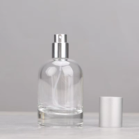 Venta al por mayor directa de fábrica: Botella de perfume redonda de vidrio transparente de 30ml, 50ml, 100ml con tapa y serigrafía para esmalte de uñas/aceite.