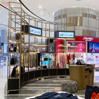 Kiosque à vêtements en acier inoxydable, présentoirs de vêtements personnalisés, présentoirs de boutique de robes pour femmes, meubles de vitrine